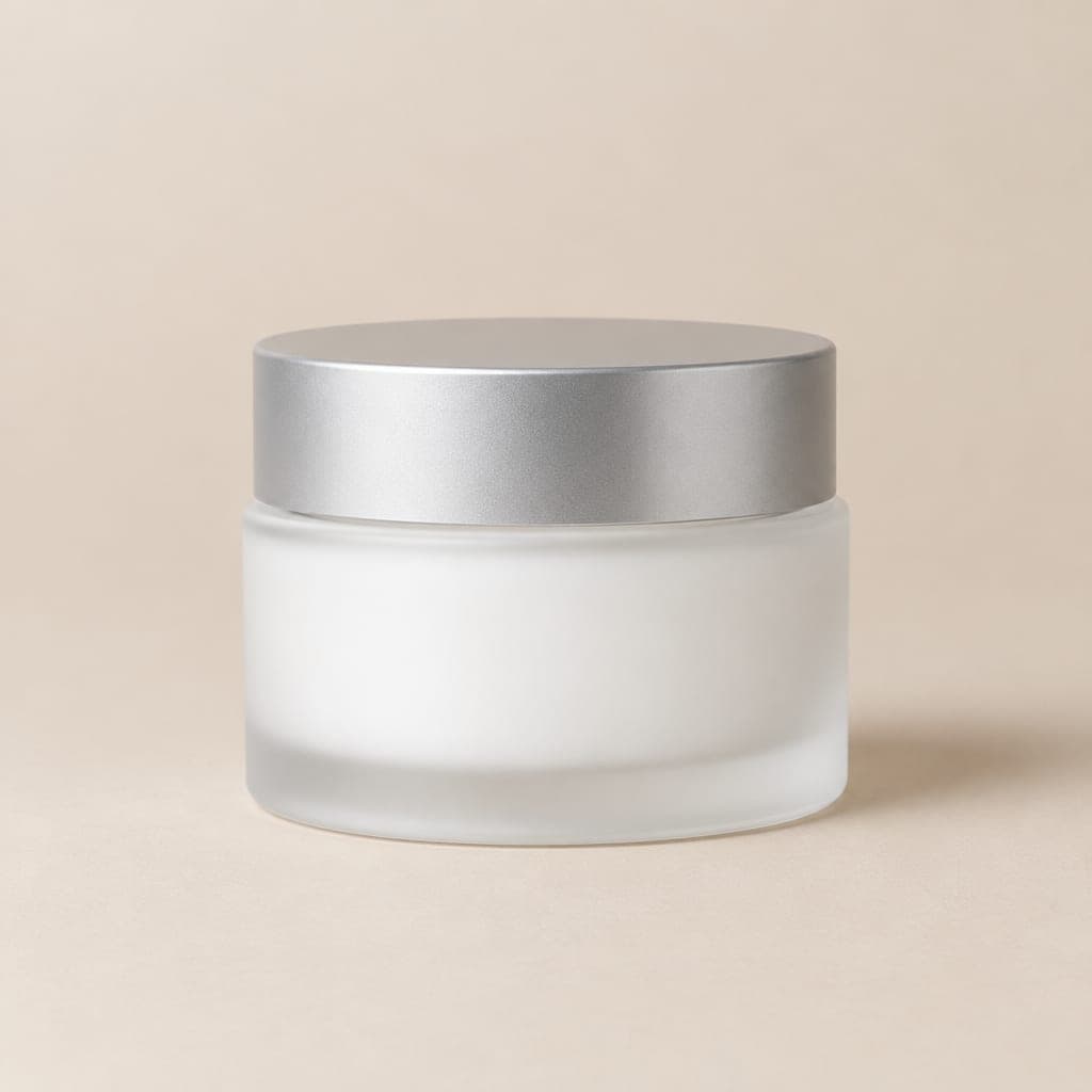 Frosted glass jar with a brushed silver lid